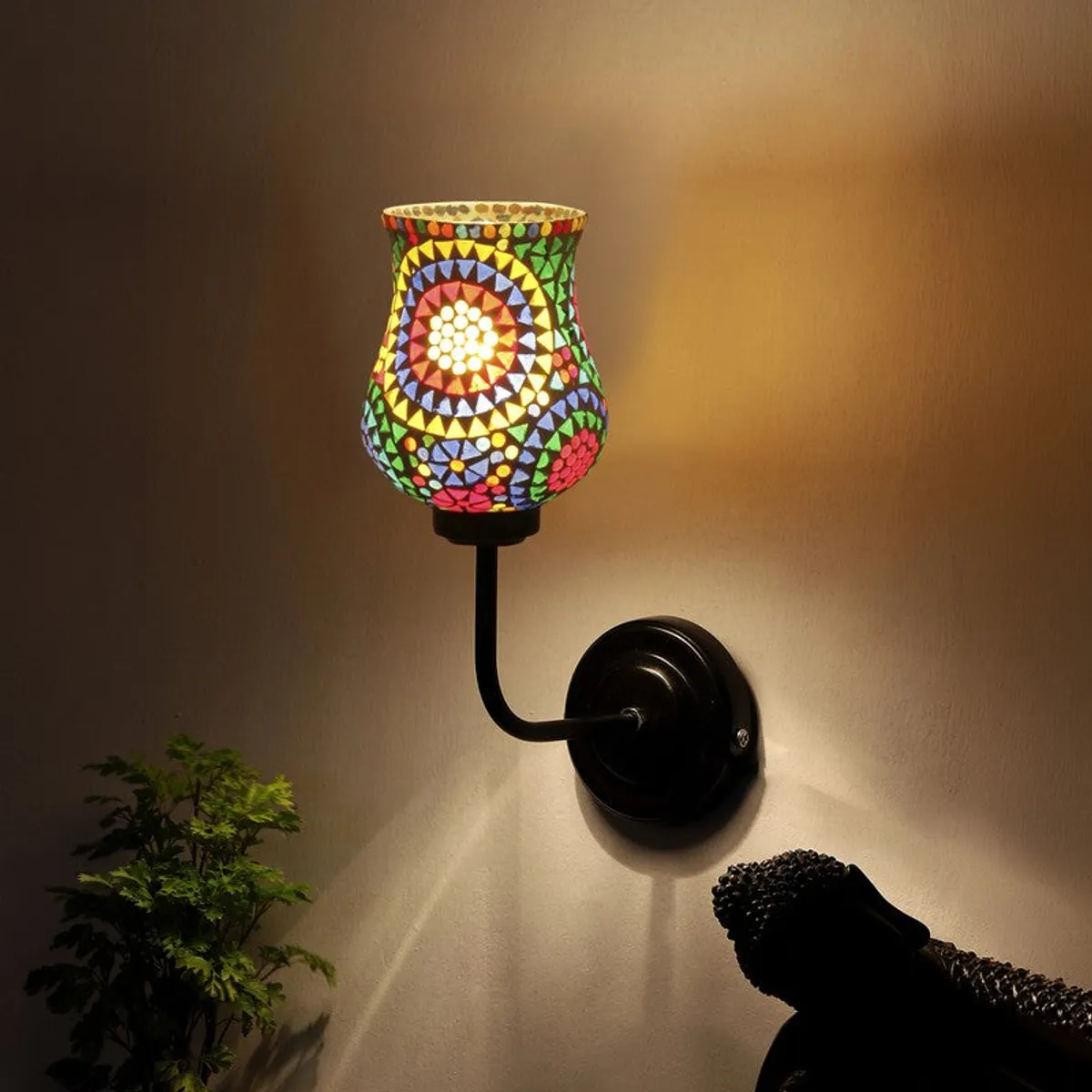 Lit mosaic glass wall lamp with colourful shade and black iron mount