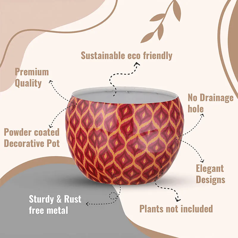 Single maroon patterned round planter shown against a graphic background