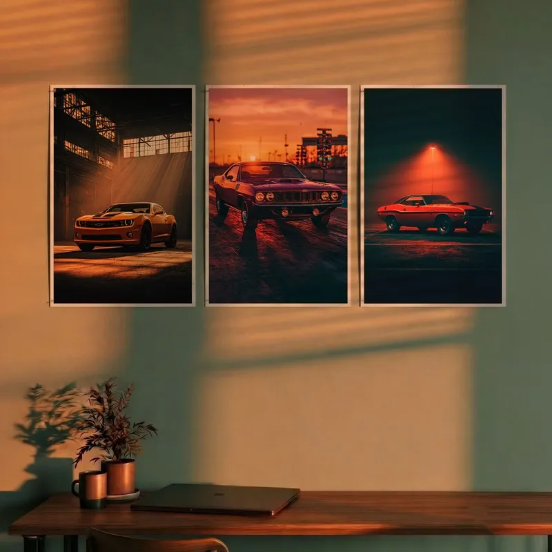 Set of three vintage muscle car posters displayed above a desk in warm light
