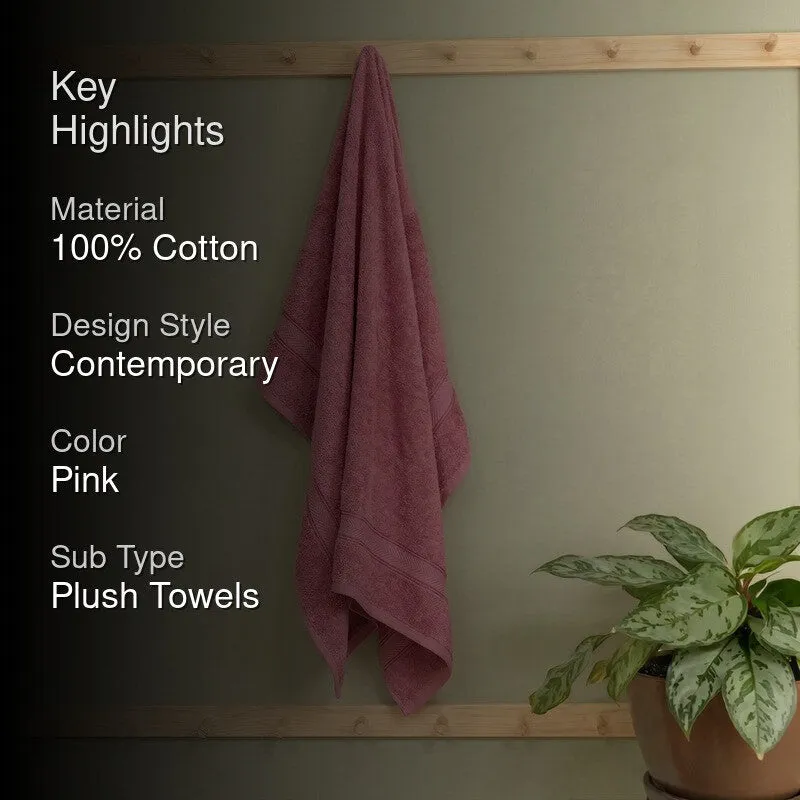 Pink bath towel hanging with key highlights text overlay
