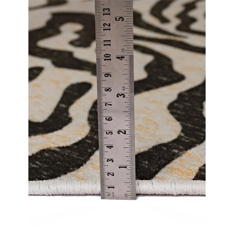 Close-up of carpet edge and surface with a ruler placed upright