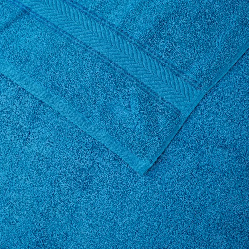 Close-up of vivid blue bath towel texture and woven border