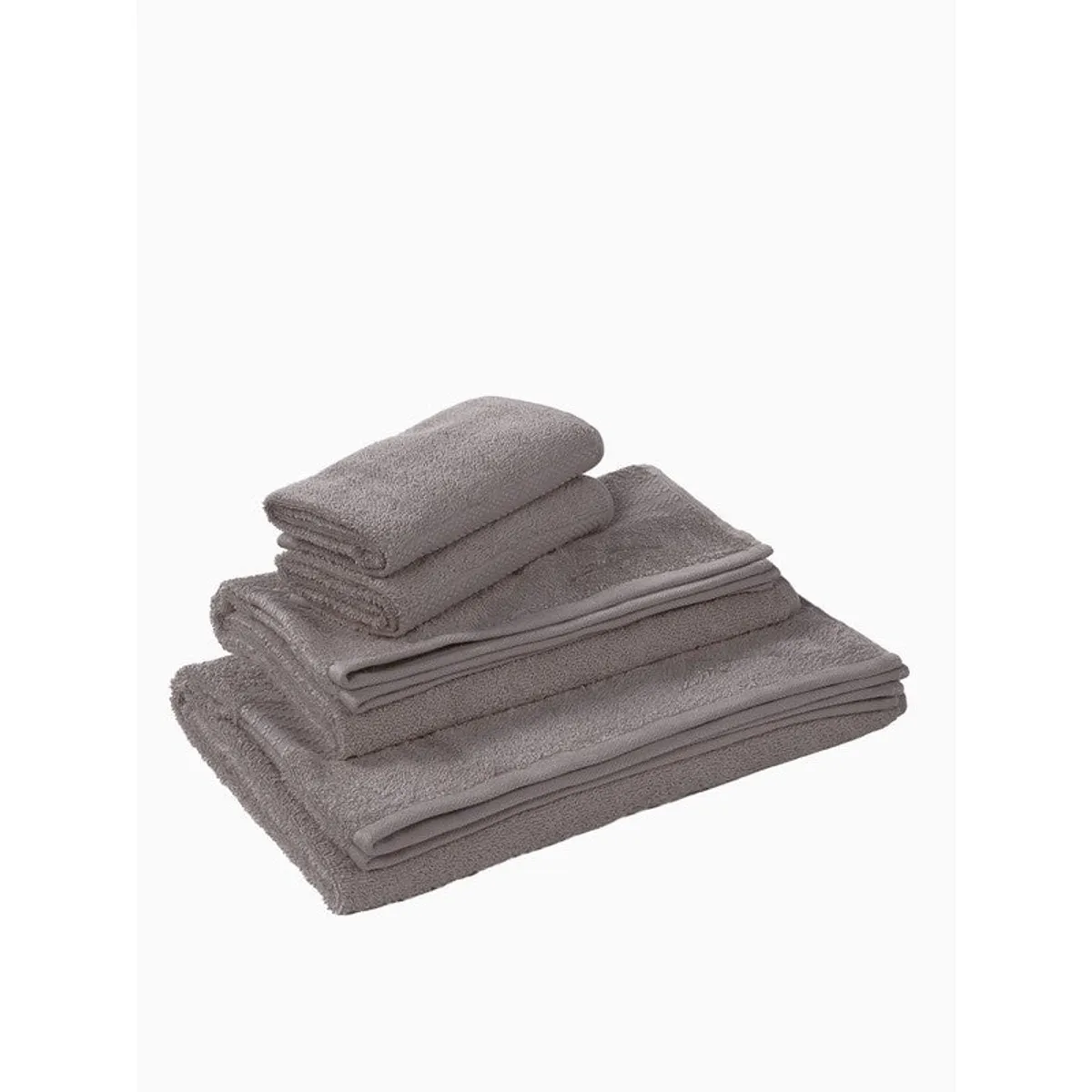 Stack of grey towels in different sizes on a white background