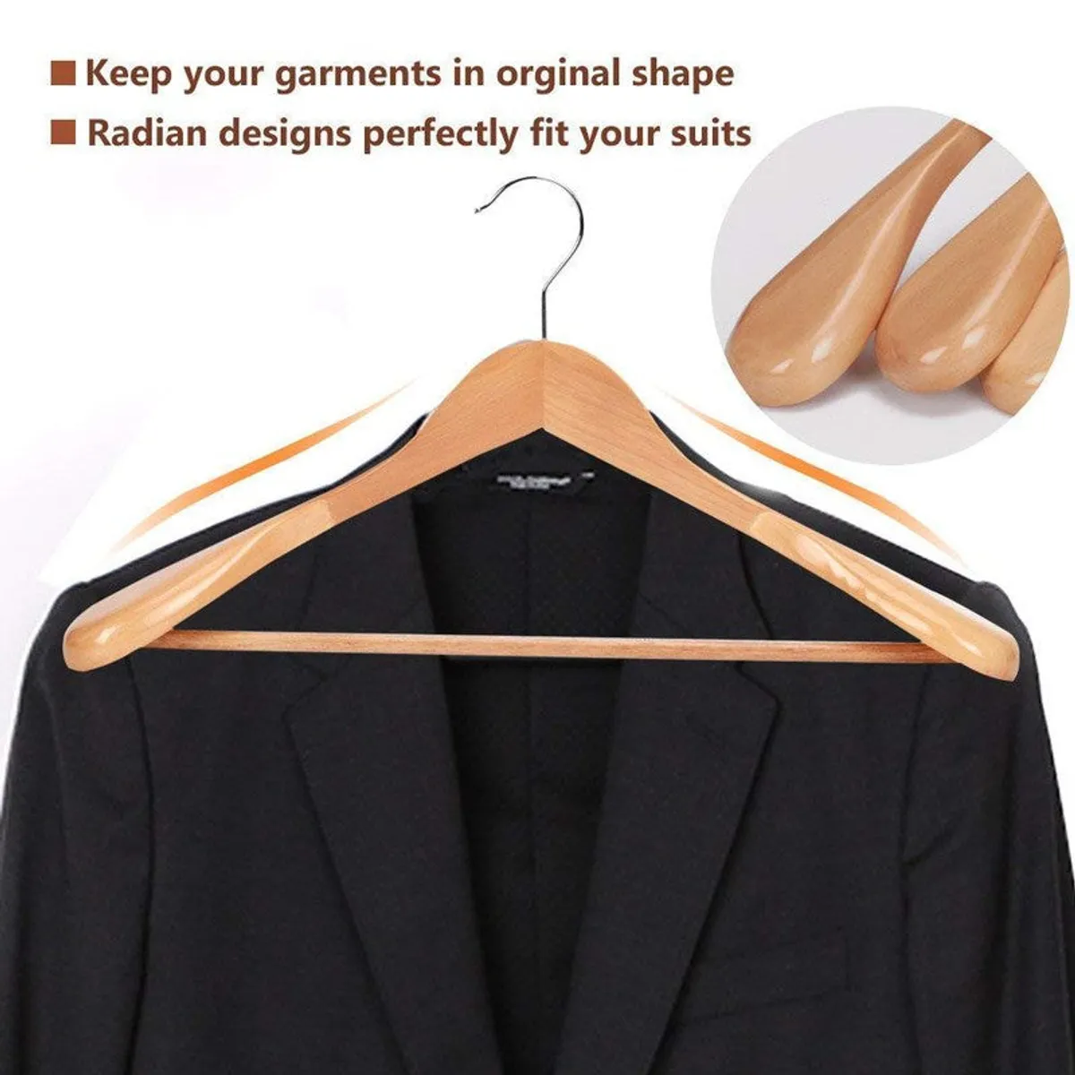 Close view of a wooden hanger holding a black blazer
