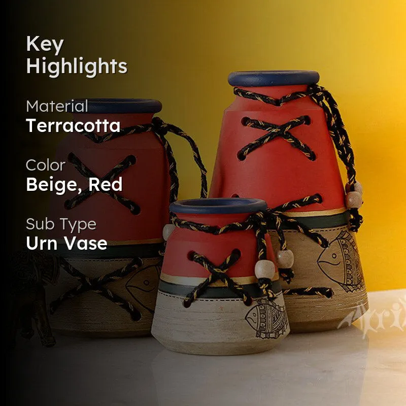 Three red and beige urn vases styled against a yellow background with a dark overlay