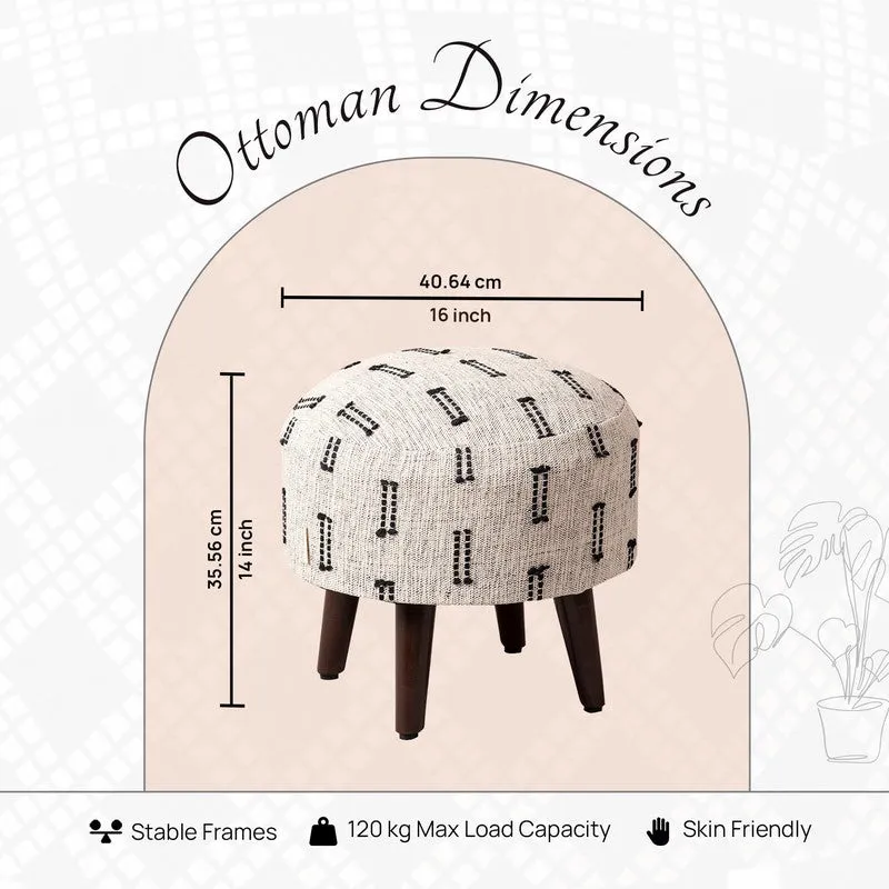 Close product view of the black-and-white patterned ottoman and dark legs