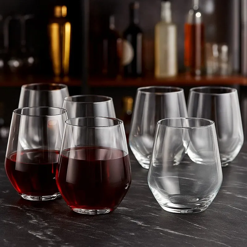 Six clear stemless glasses, two filled with red wine
