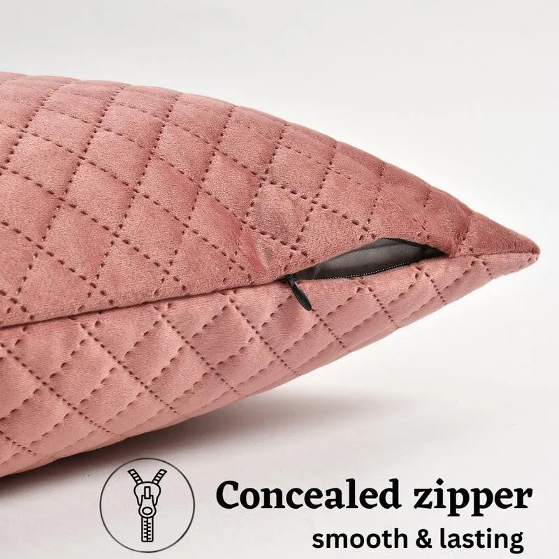 Close-up of pink diamond-quilted velvet cushion cover fabric