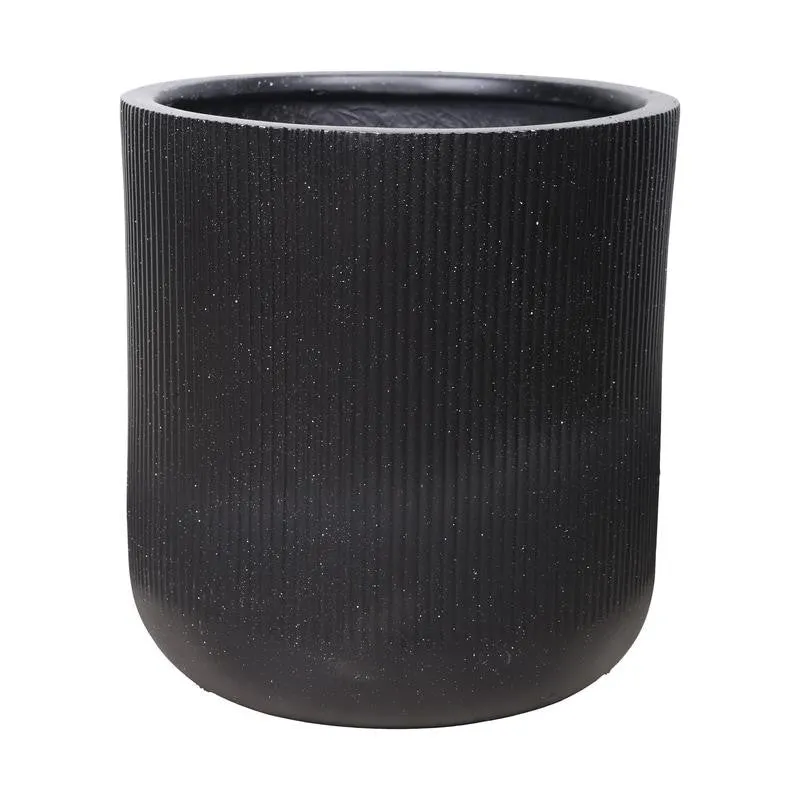 Close-up of the black planter showing its ribbed surface and rounded base.