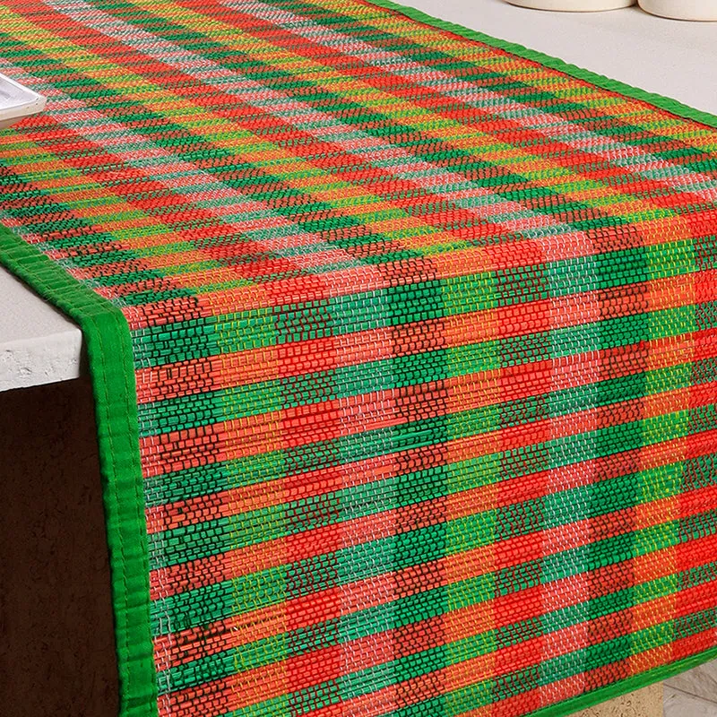 Detailed view of the vibrant checked bamboo runner draped over a table edge