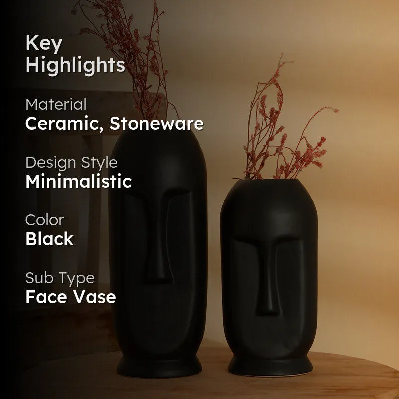 Two matte black face vases styled on a tabletop with a dark text overlay.