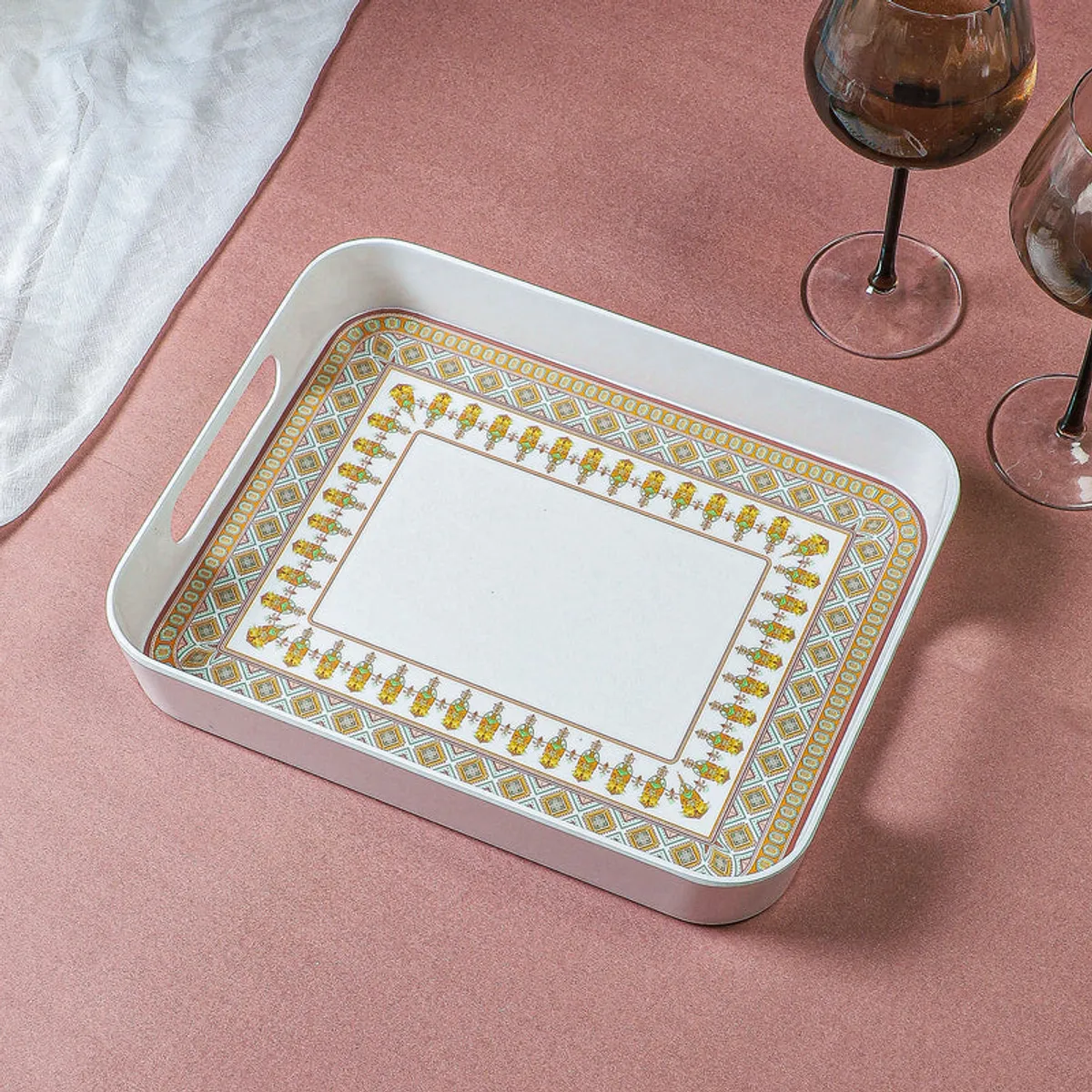 Rectangular white serving tray with beige floral border viewed from above