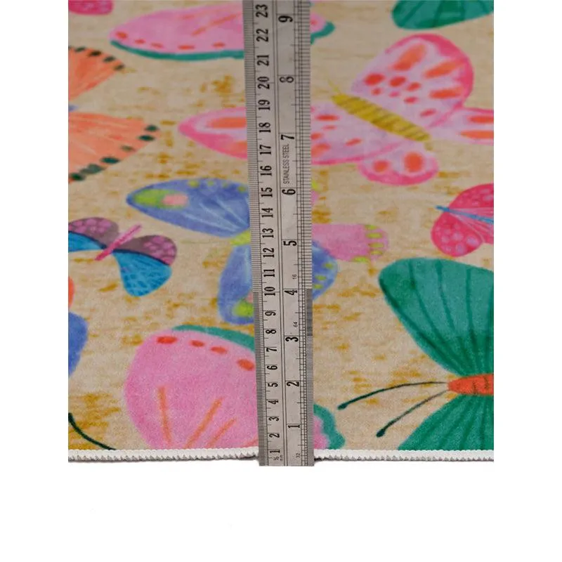 Close-up of the carpet surface with butterfly pattern and ruler