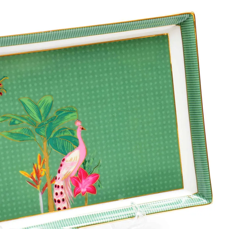 Close-up of the green platter showing its pink peacock, tropical foliage and striped border