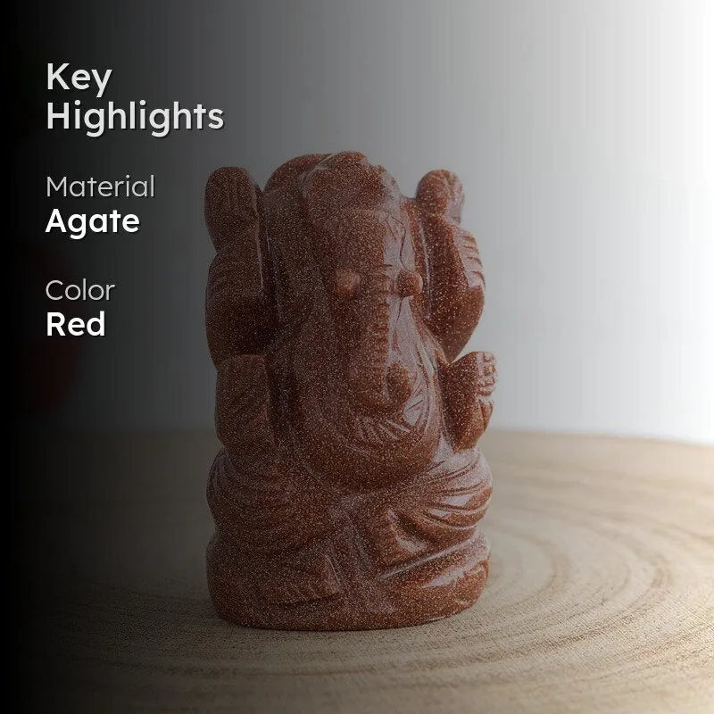 Red agate Lord Ganesha showpiece styled on a wooden surface