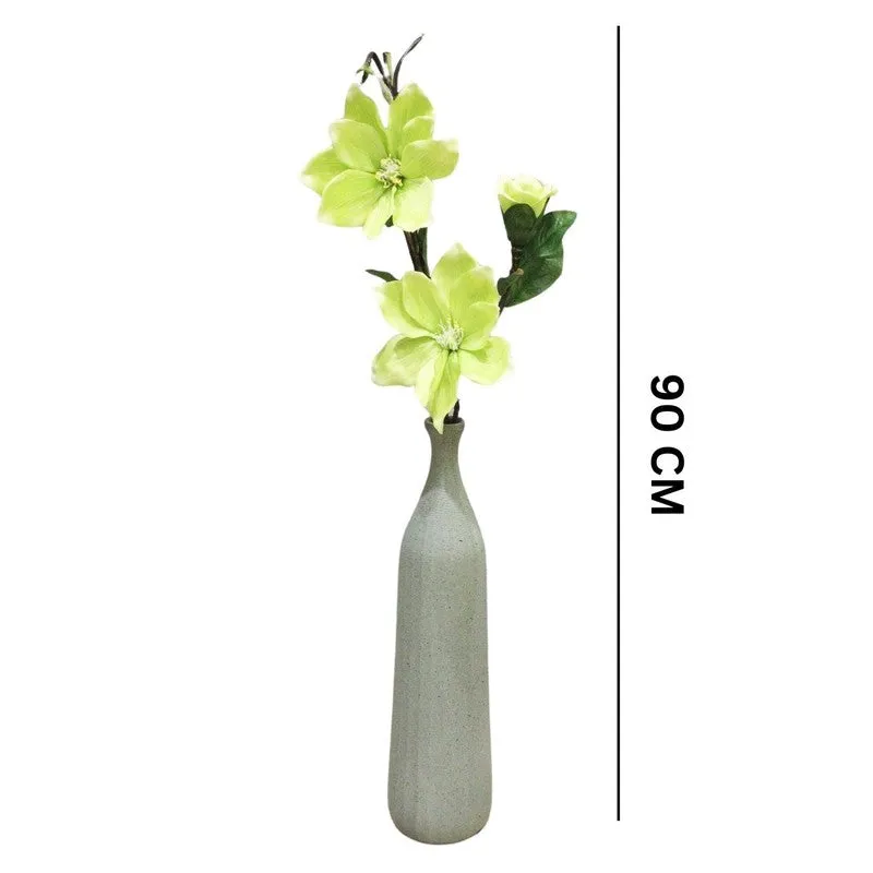 Green artificial magnolia flower stick shown with its overall height