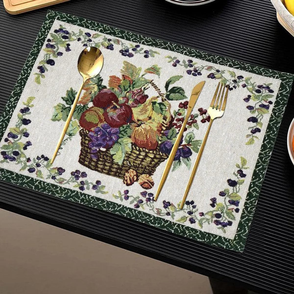 Jacquard placemat styled with cutlery on a dark dining surface
