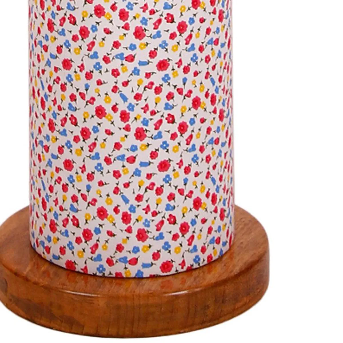 Close-up of the floral printed shade and wooden base of the lamp