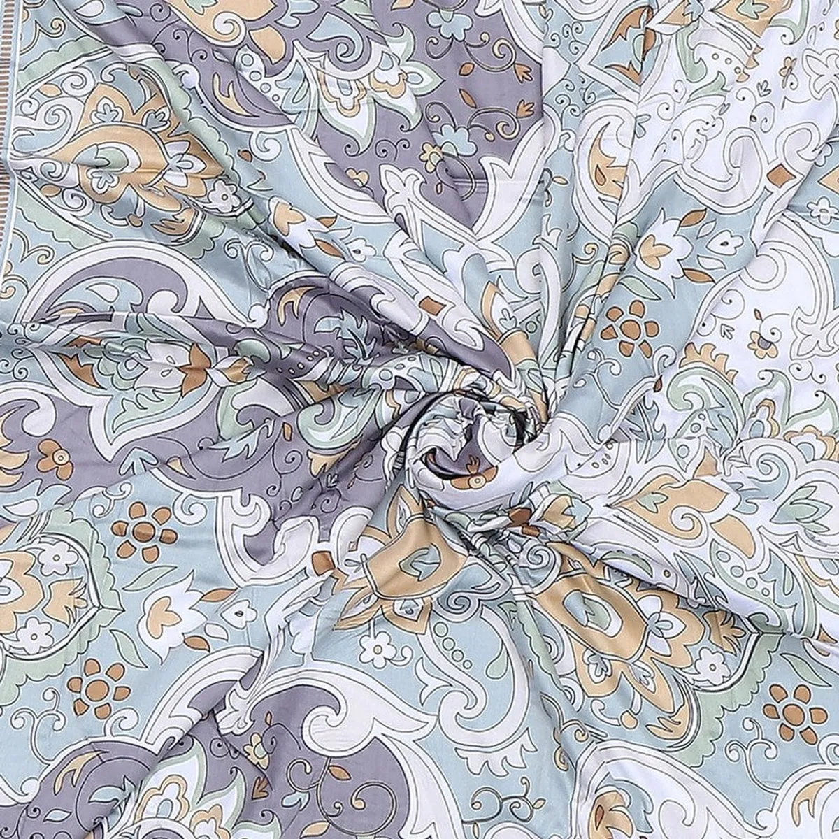 Detailed view of the multicolour printed fabric with ornate floral and paisley motifs