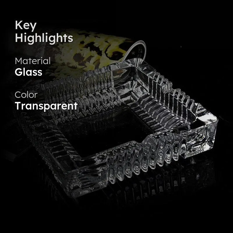 Transparent glass ashtray with ribbed edges on a dark background