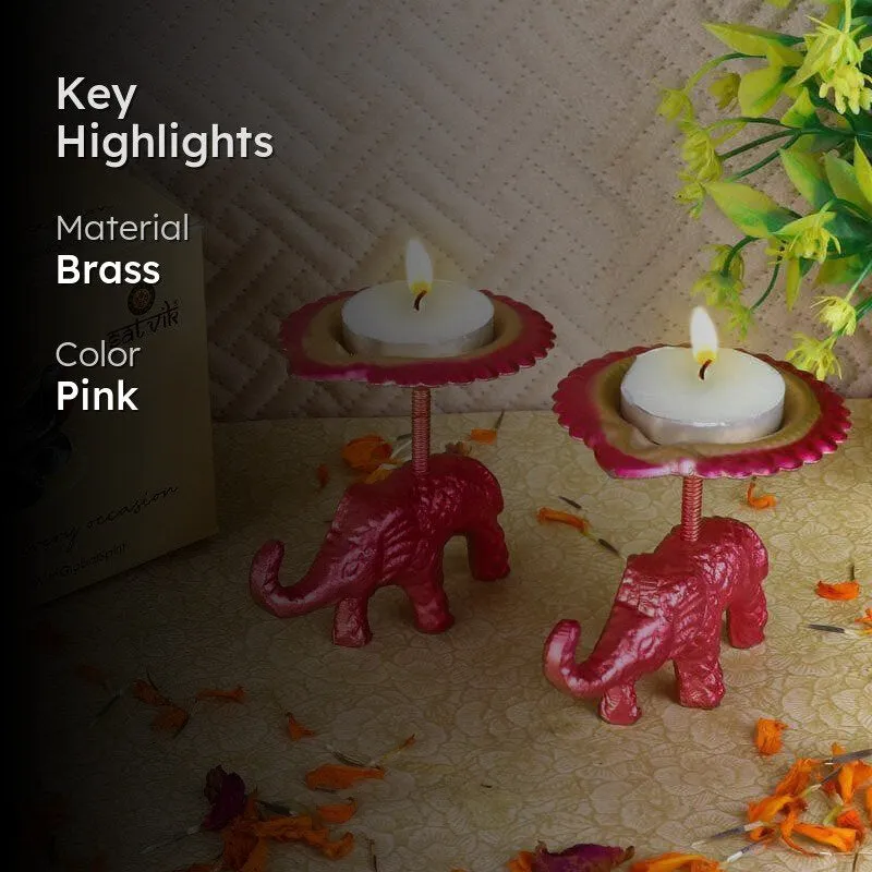 Pink elephant tealight holders with lit candles and highlighted material and colour