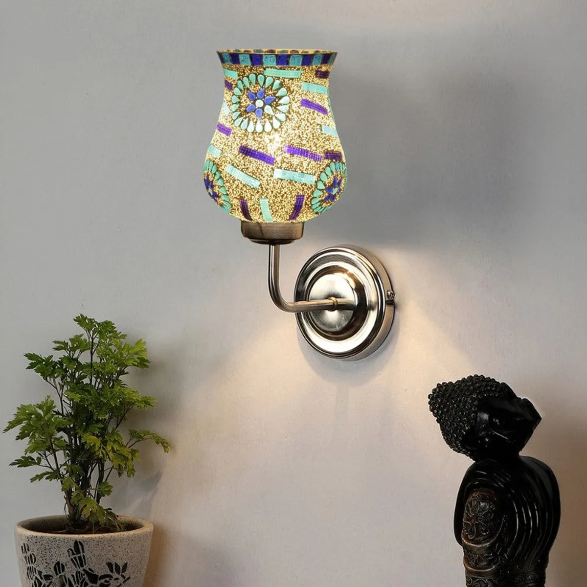 Lit mosaic glass wall lamp with floral motif and steel base