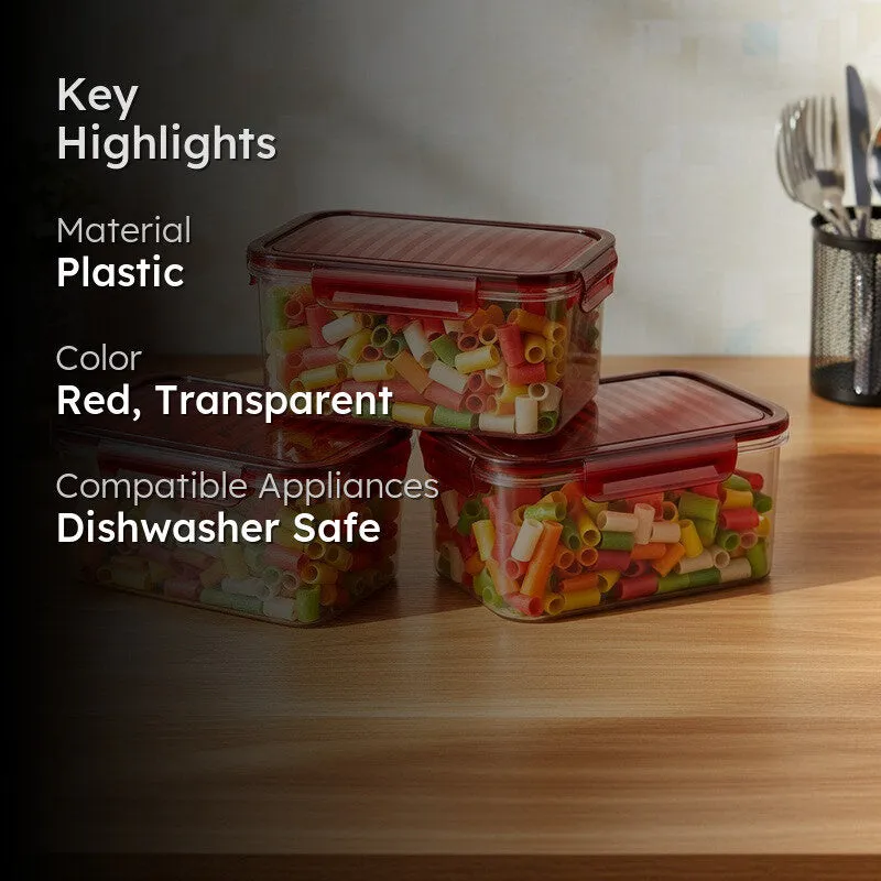 Three red-lidded transparent food containers arranged on a kitchen counter