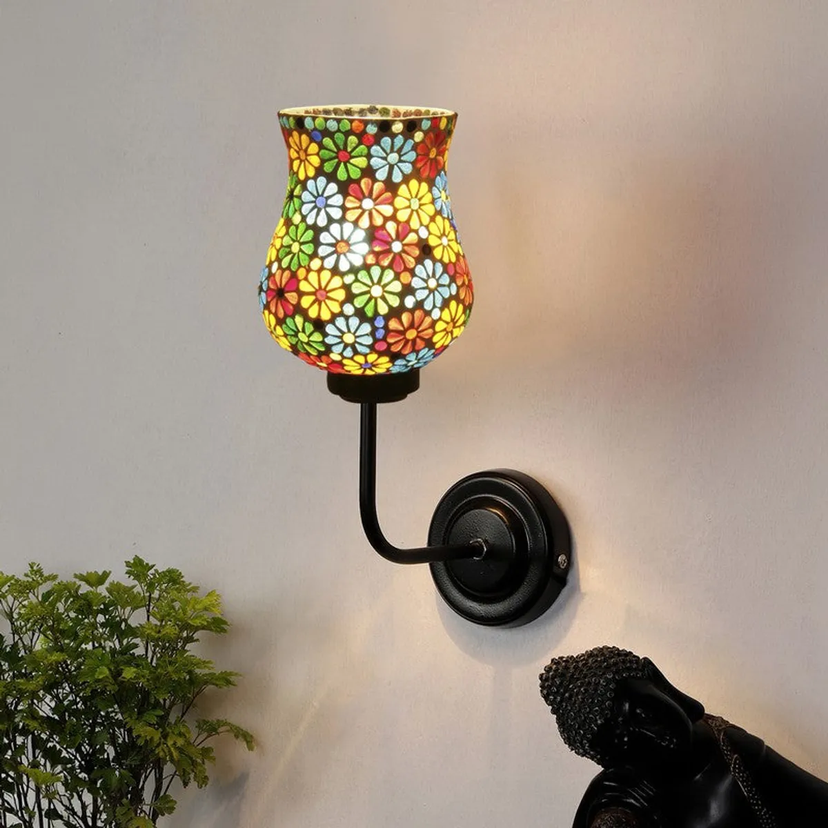 Lit floral mosaic glass wall lamp with black iron base
