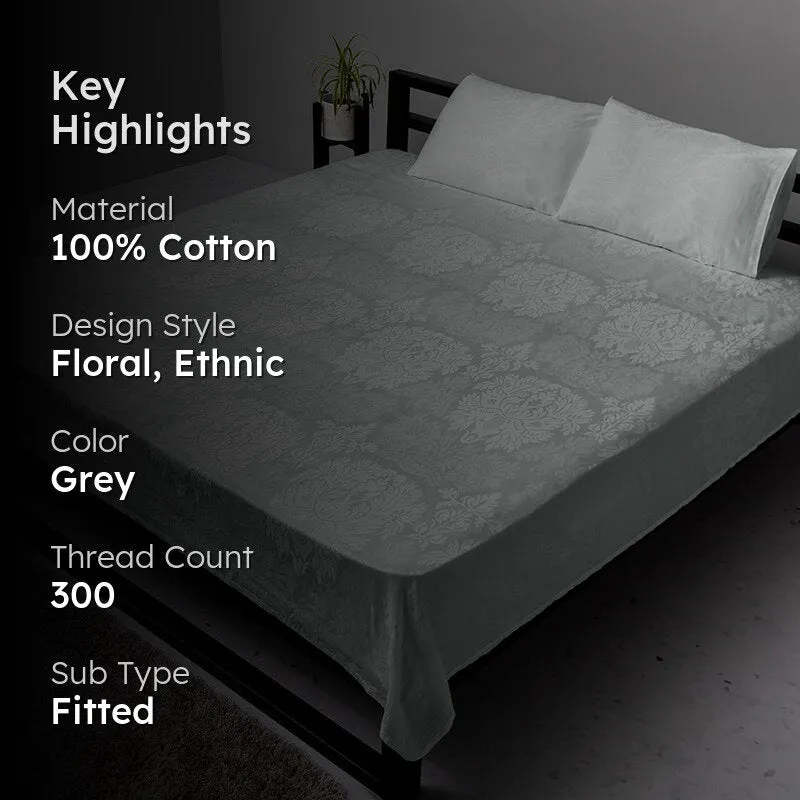 Light grey fitted floral bedsheet shown on a bed