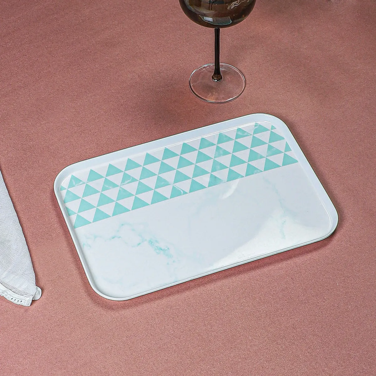 Blue-and-white geometric serving tray shown at an angled view