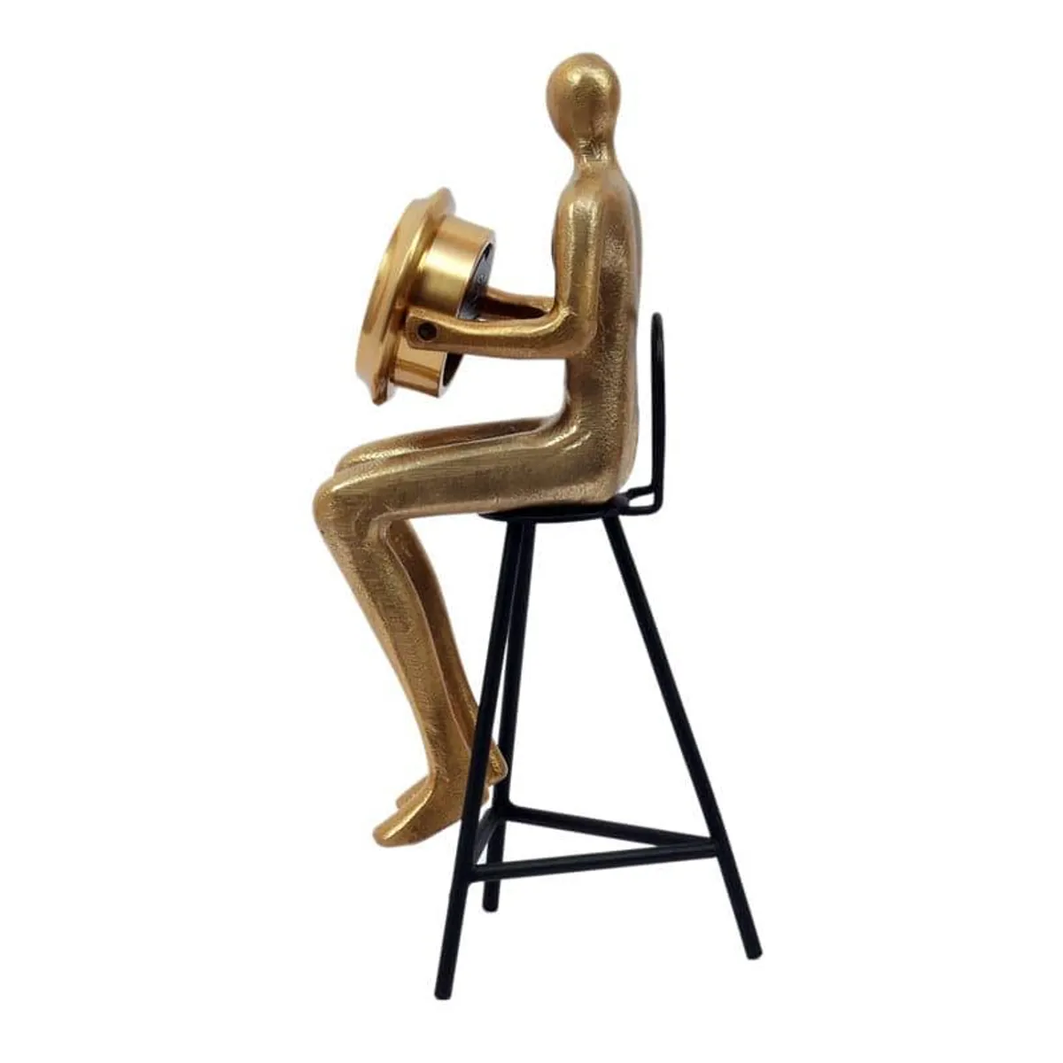 Side view of the gold figurine clock seated on a black stool