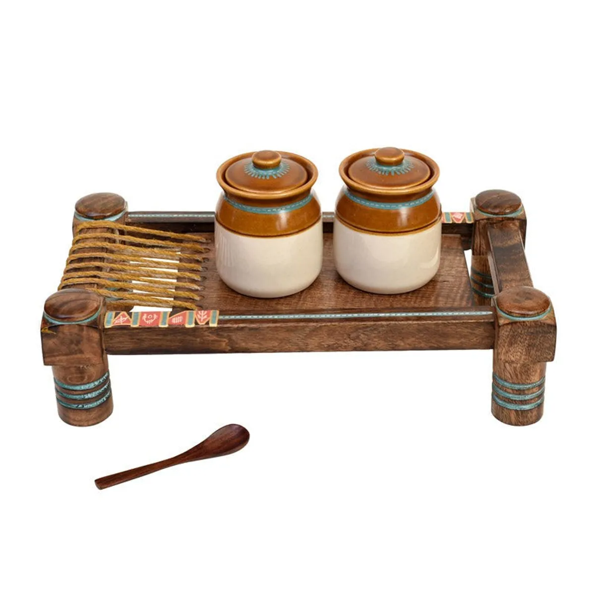Two lidded ceramic condiment jars arranged on a brown wooden tray