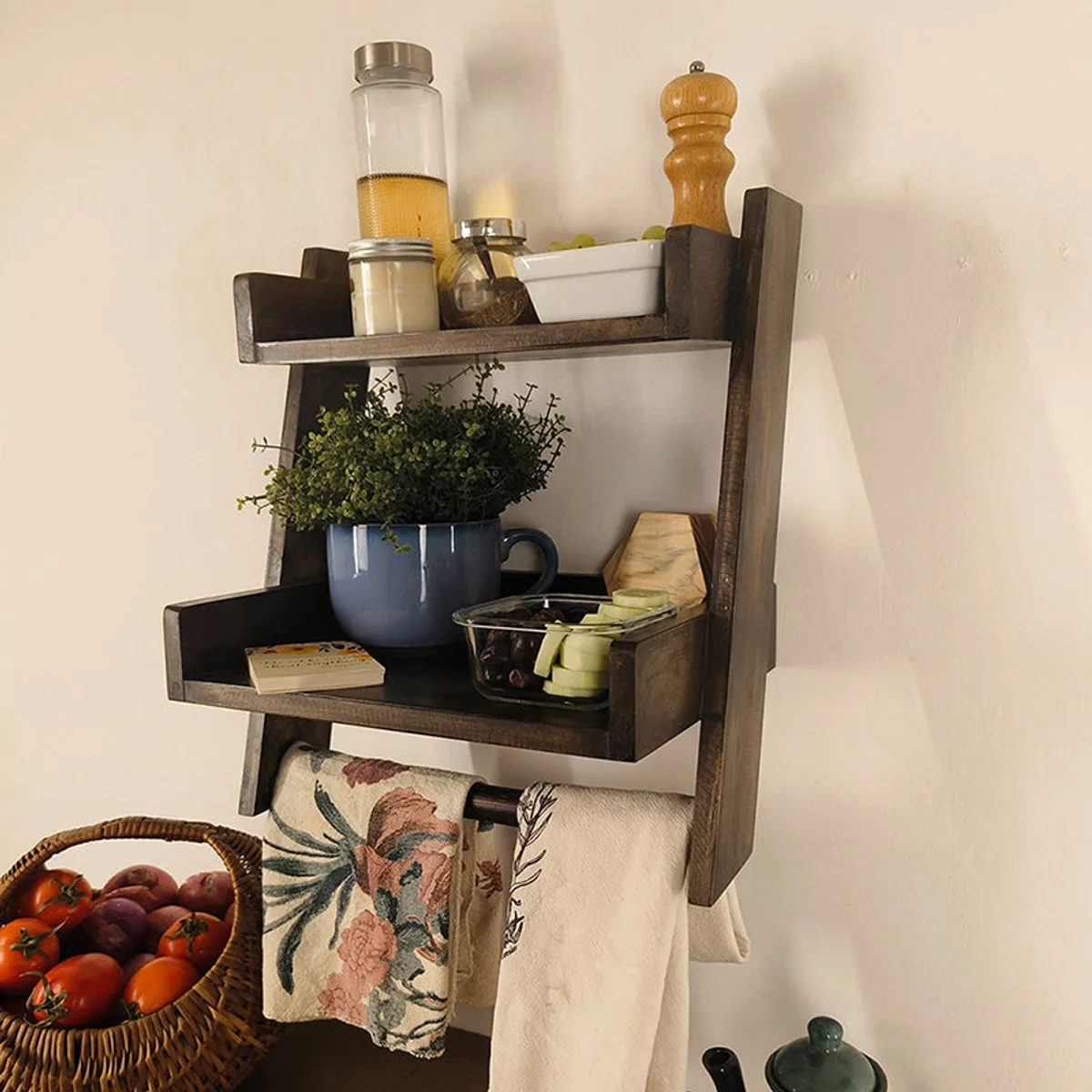 Side view of a rustic brown wooden shelf with raised edges and towel bar