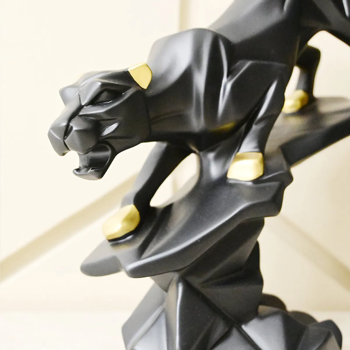 Close-up angled view of the black panther showpiece on its base