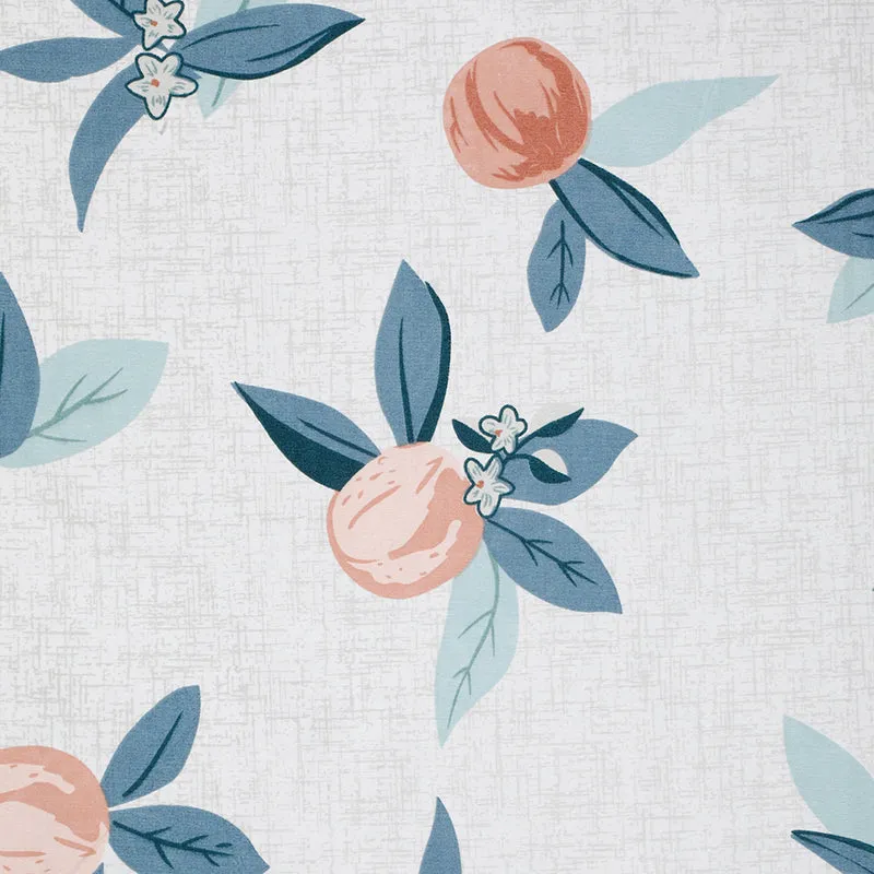 Detailed view of the floral print on the white bedsheet