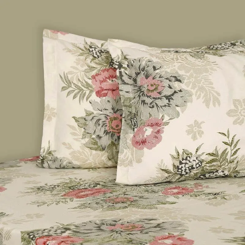 Close-up of matching floral pillow covers on the cream bedsheet