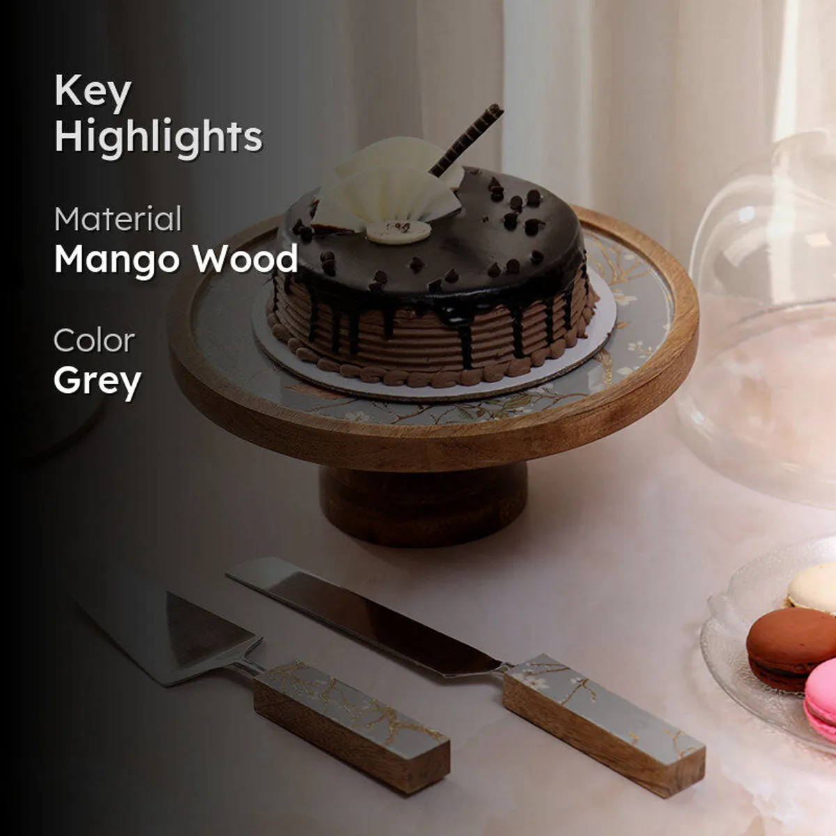 Cake stand set styled with a decorated cake and matching serving tools