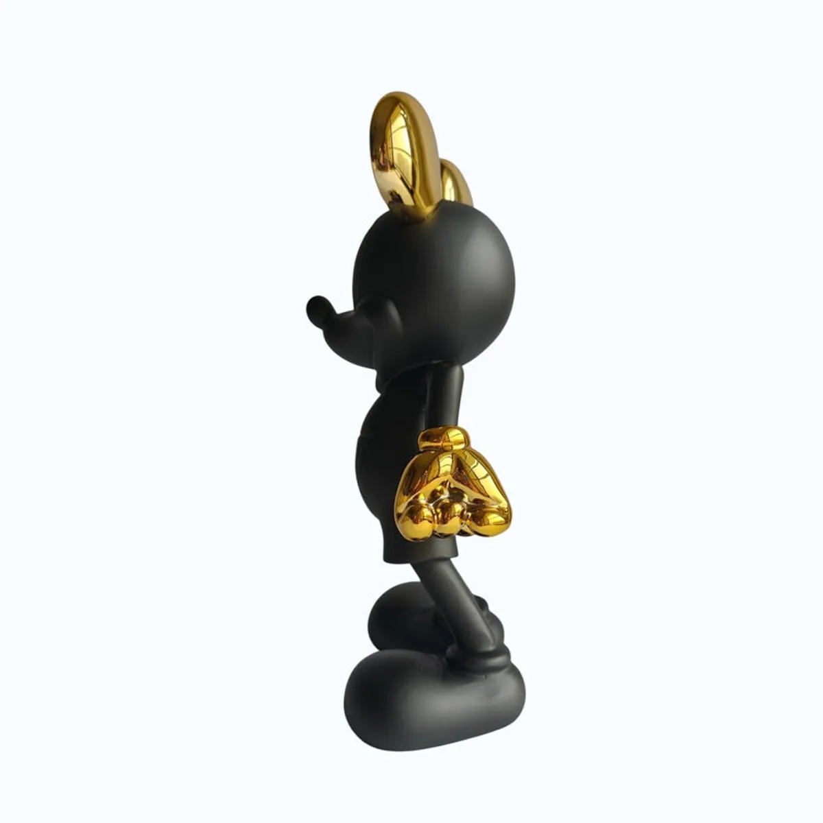 Side profile of the black and gold character-inspired showpiece