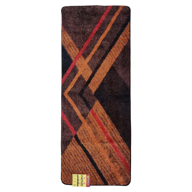 Brown runner rug with angular geometric pattern on a plain background