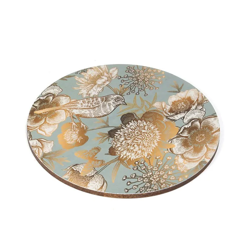 Close-up view of one round floral and bird table mat