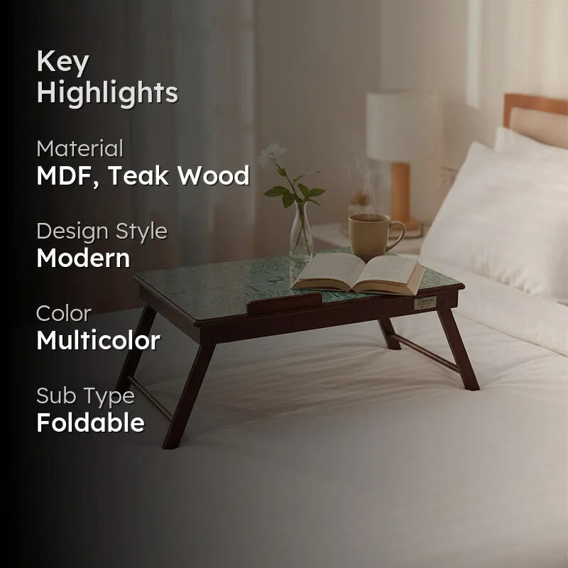 Lifestyle view of the laptop stand beside a bed, with material and style highlights