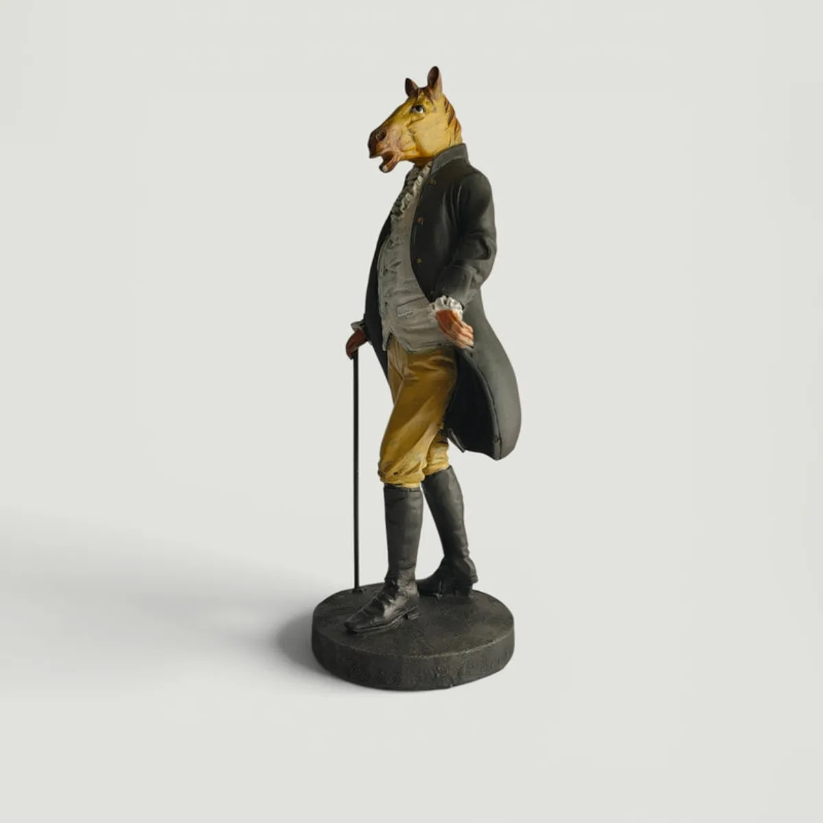 Side view of the horse-headed gentleman figurine on a plain background