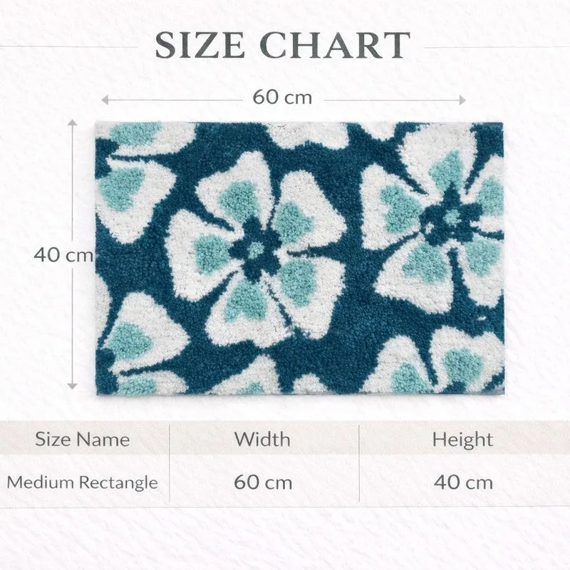 Green and white floral rectangular bath mat shown flat