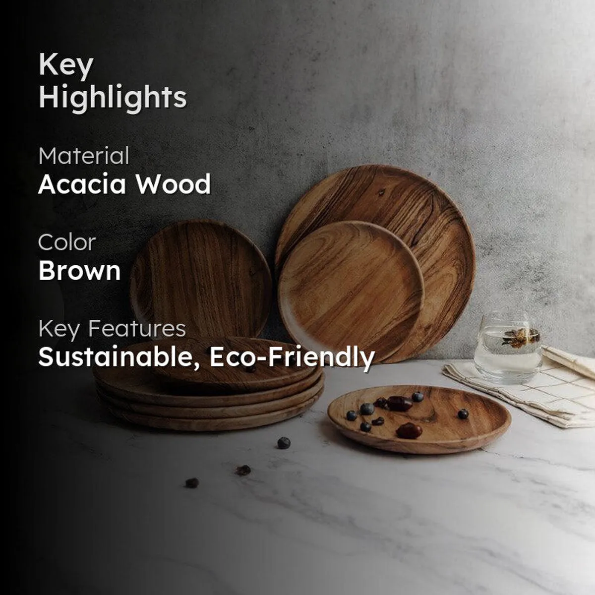 Brown wooden plates styled on a table with berries and floral decor