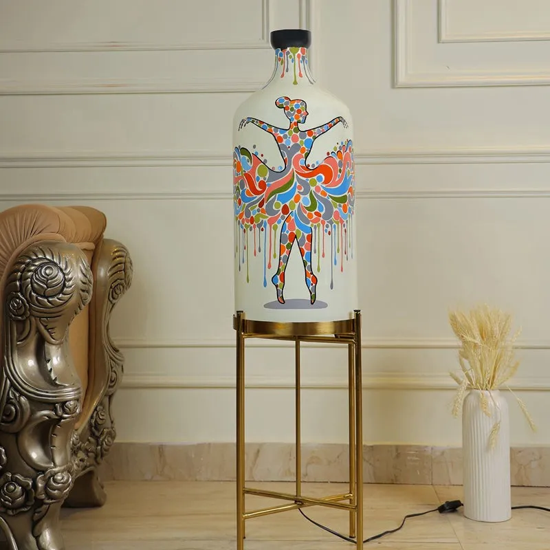 Multicolour glass floor lamp with dancer motif and metal stand