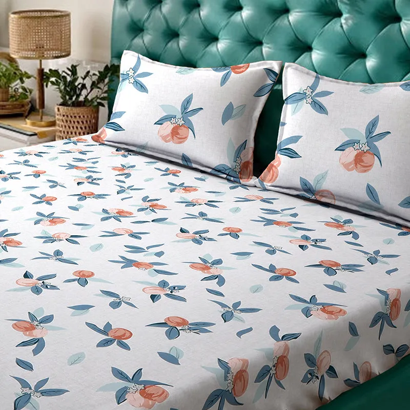Close view of white floral bedsheet and matching pillow covers