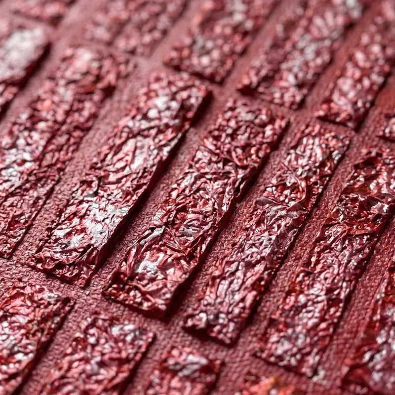 Macro view of the glossy textured maroon pattern on canvas