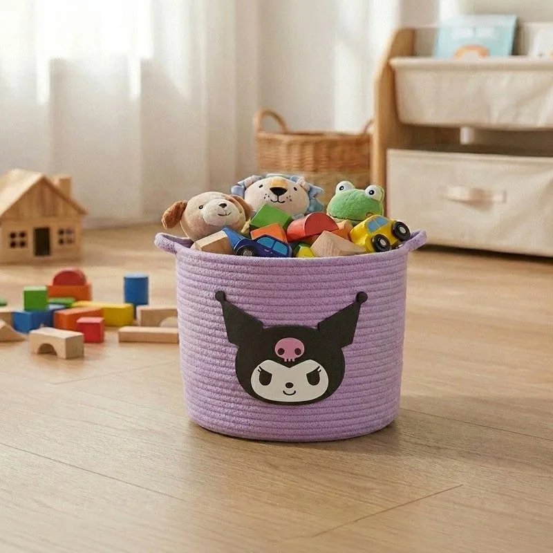 Purple cylindrical cotton storage basket with black character motif, filled with toys