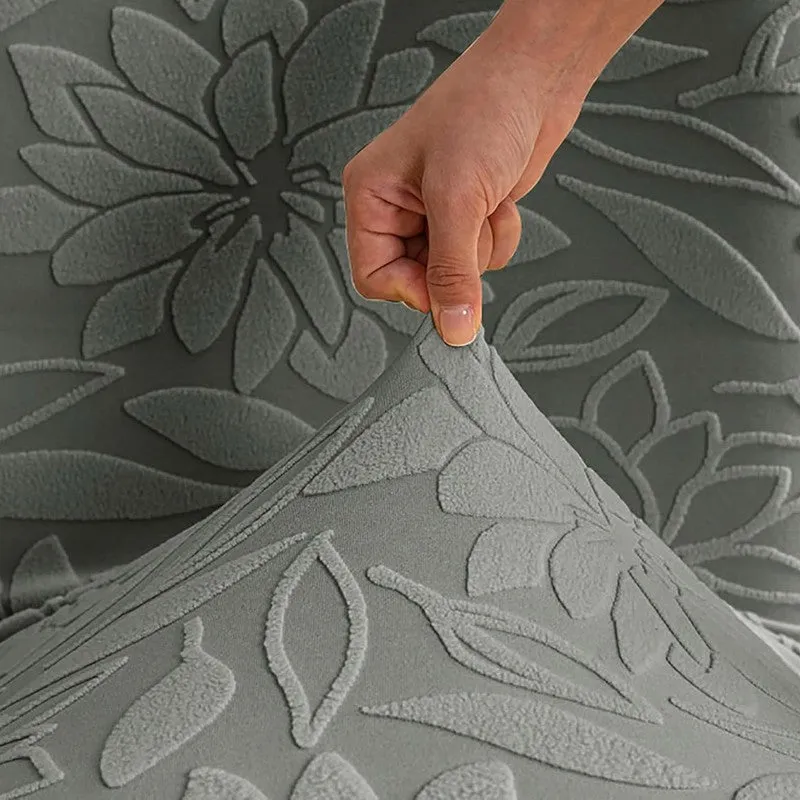 Close-up of grey chair cover fabric with stretch and floral texture