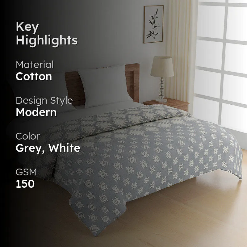 Grey and white comforter with key highlights graphic overlay